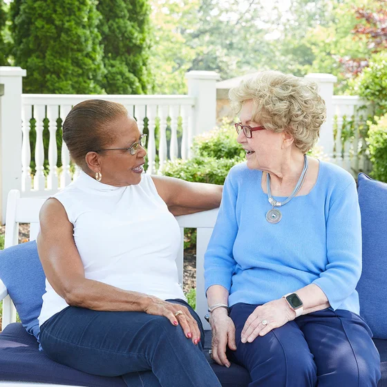 Two senior women laughing 