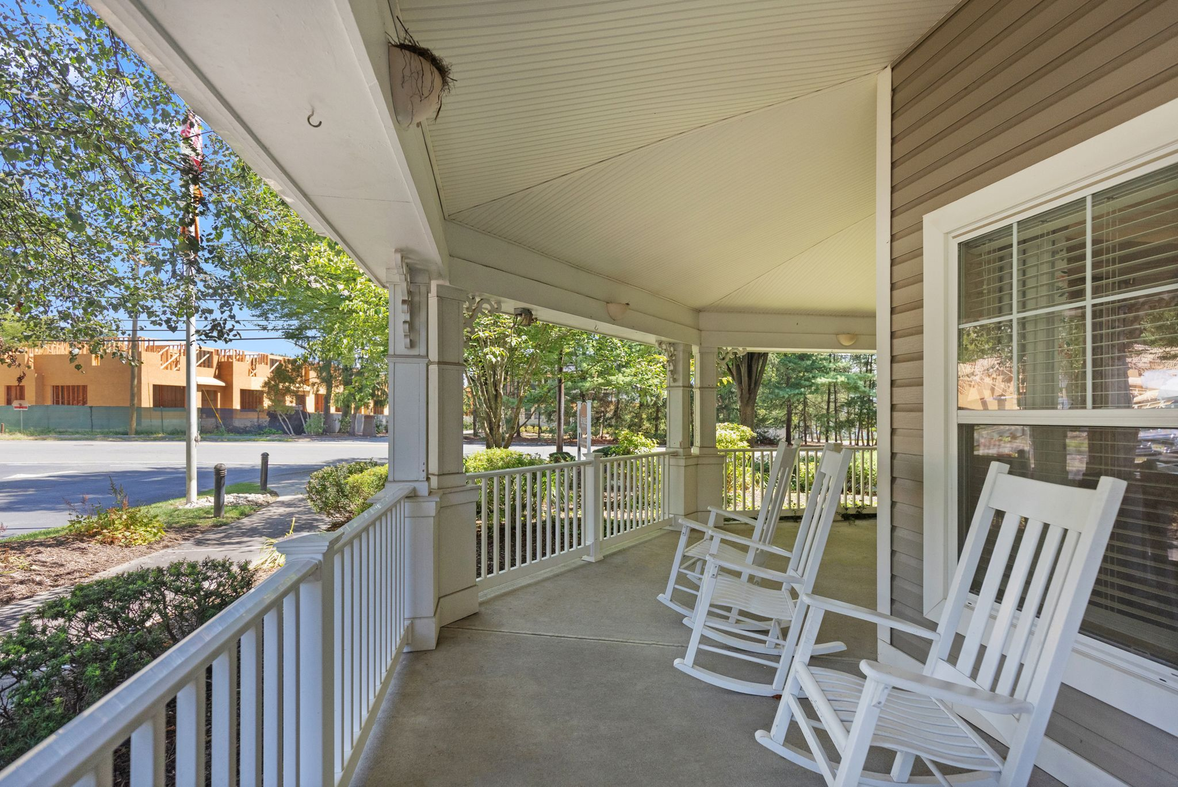 Porch with rocking chairs at Monarch Paramus