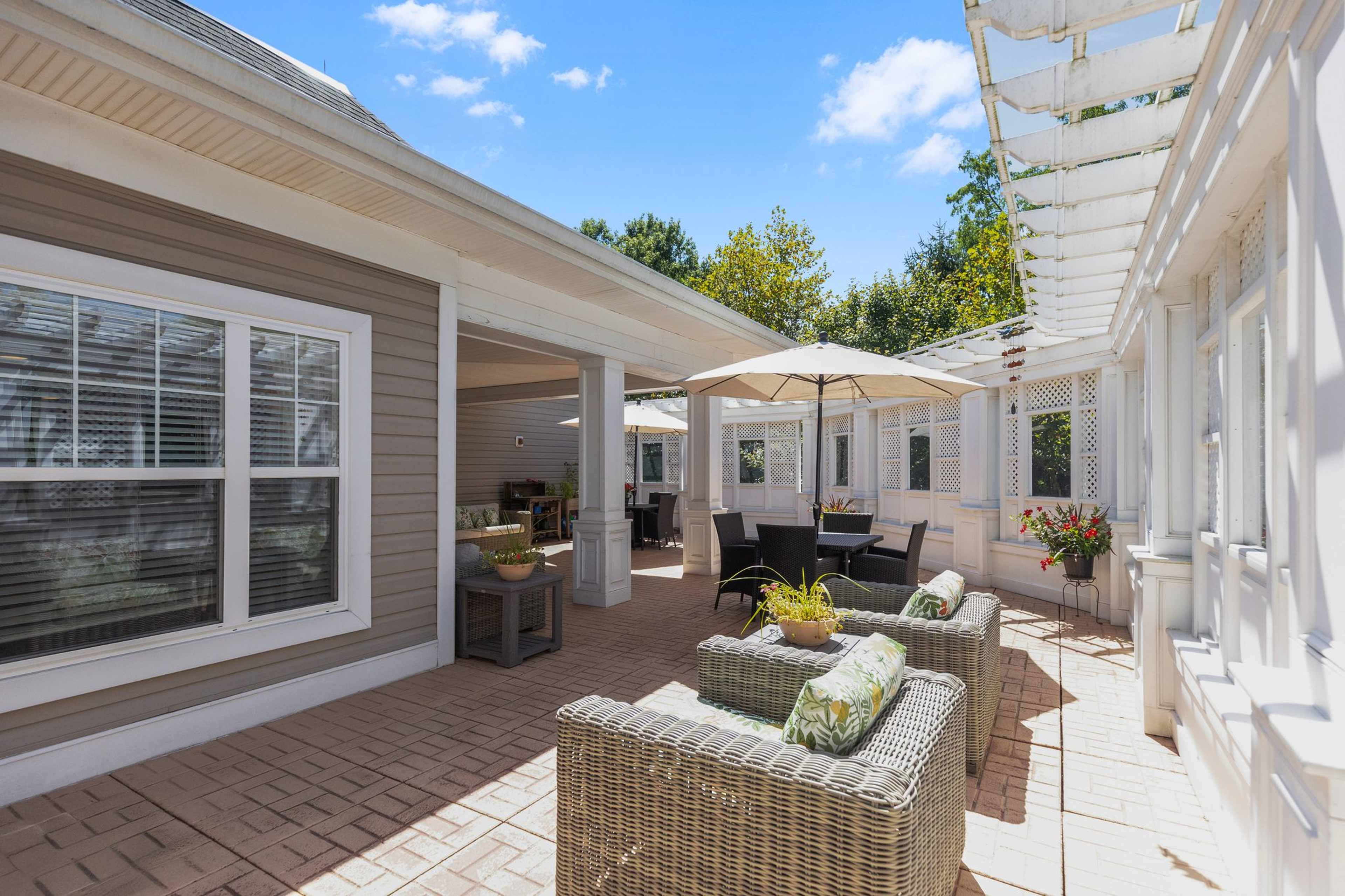 Patio at Monarch Paramus with chairs and umbrella