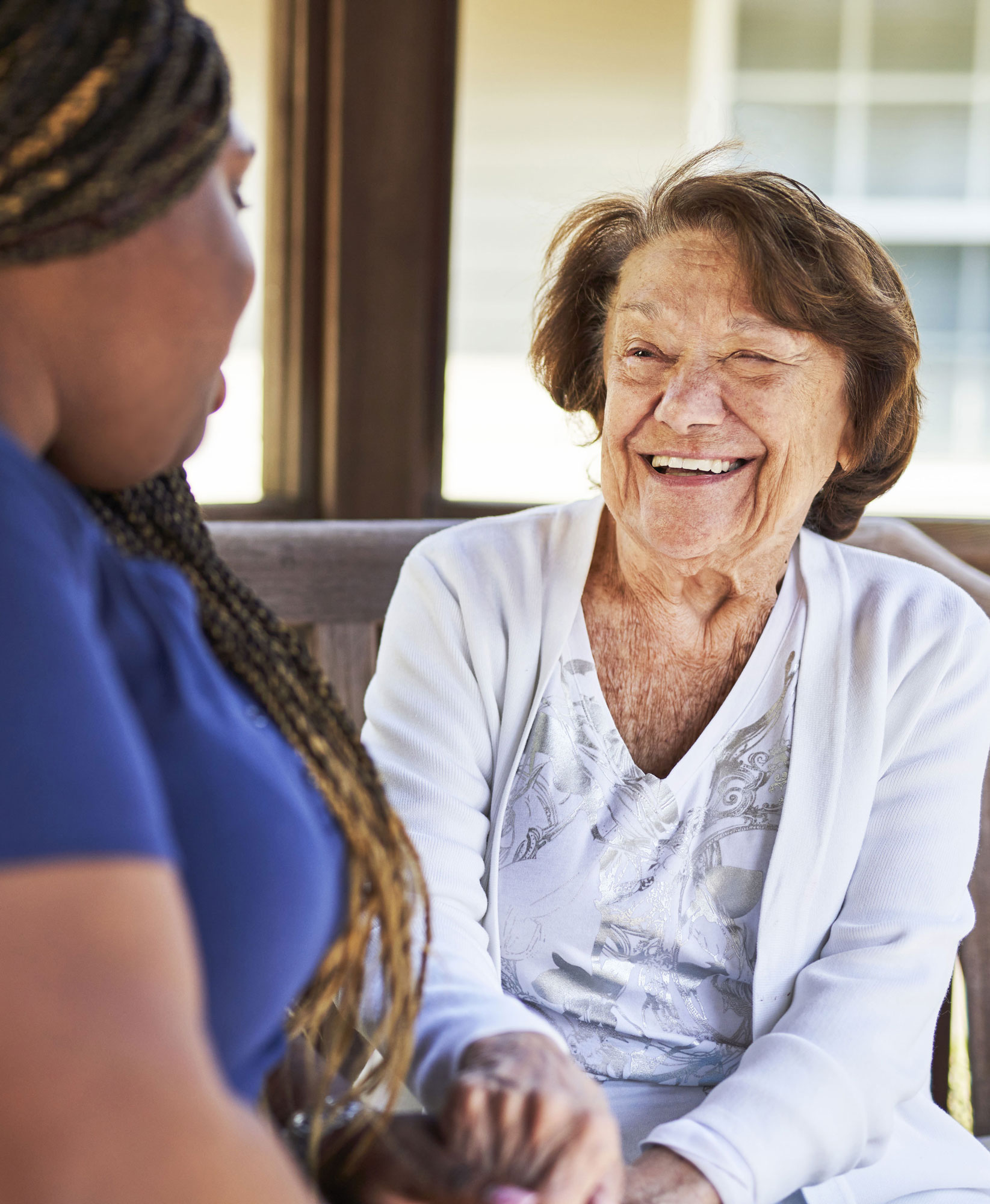 Memory Care Resident Smiling in Courtyard