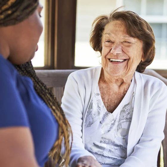 Memory Care Resident Smiling in Courtyard