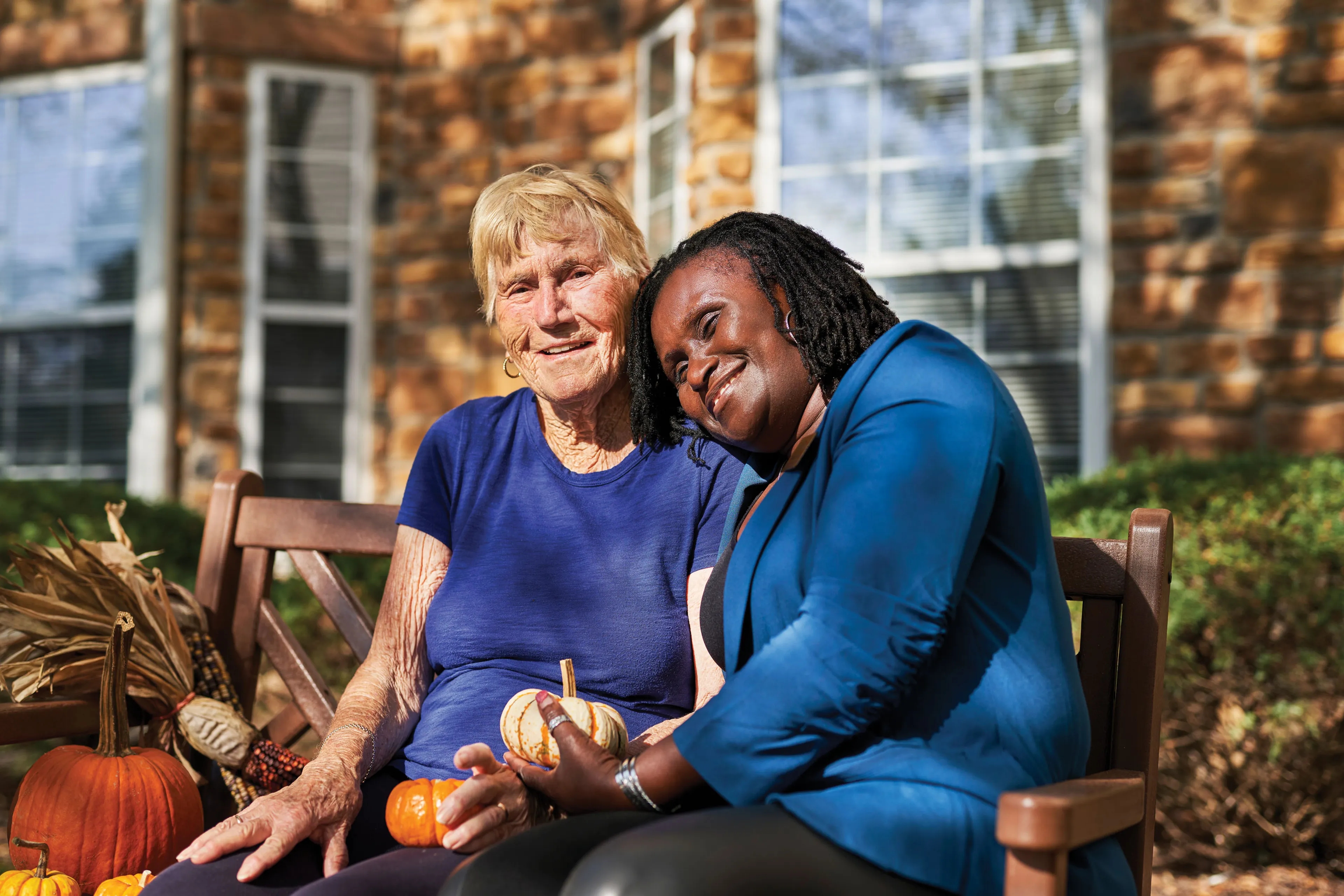 Assisted Living Resident and Caregiver in Courtyard