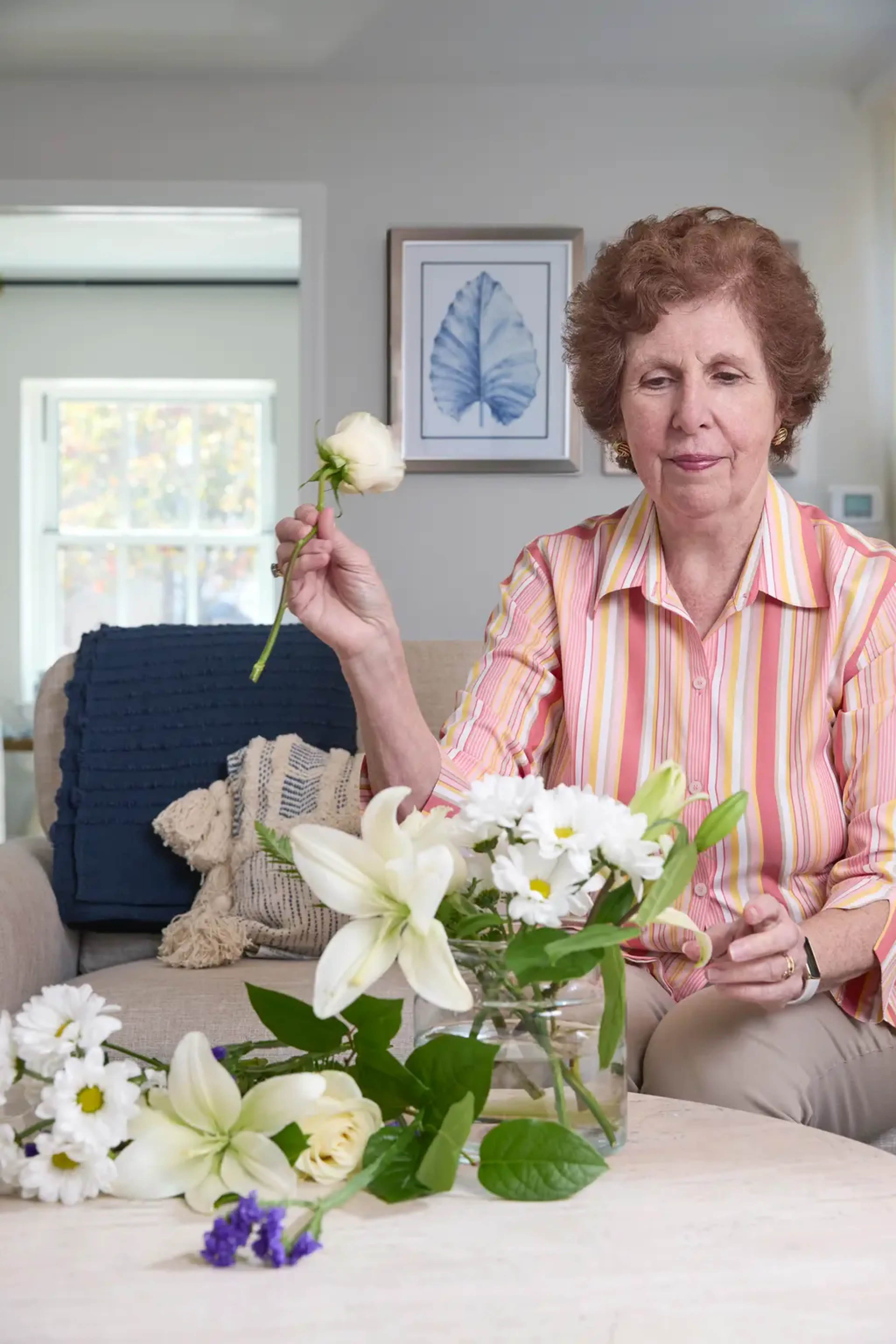 Woman arranging flowers