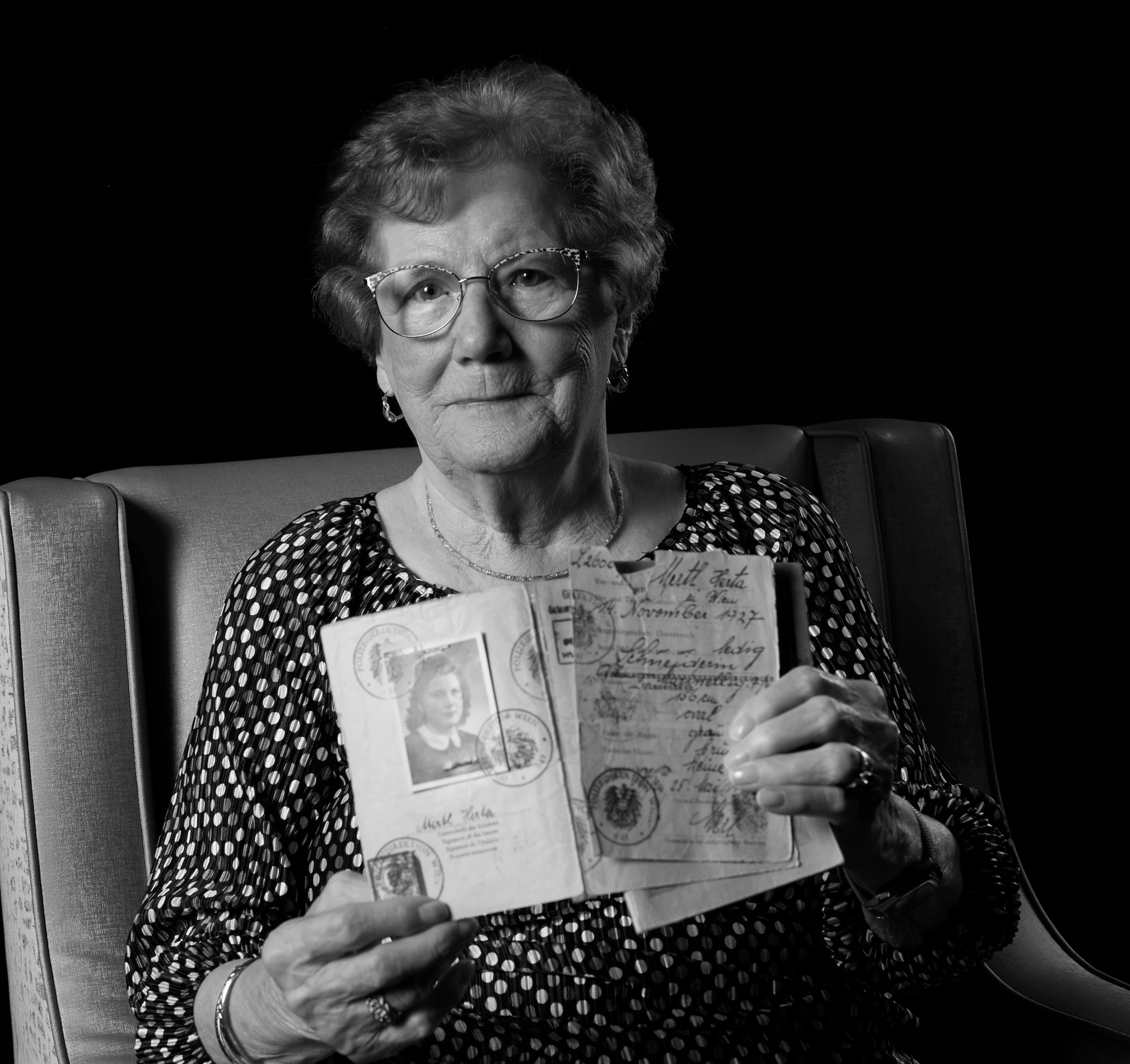 Photo of Herta C. holding her Austrian papers.