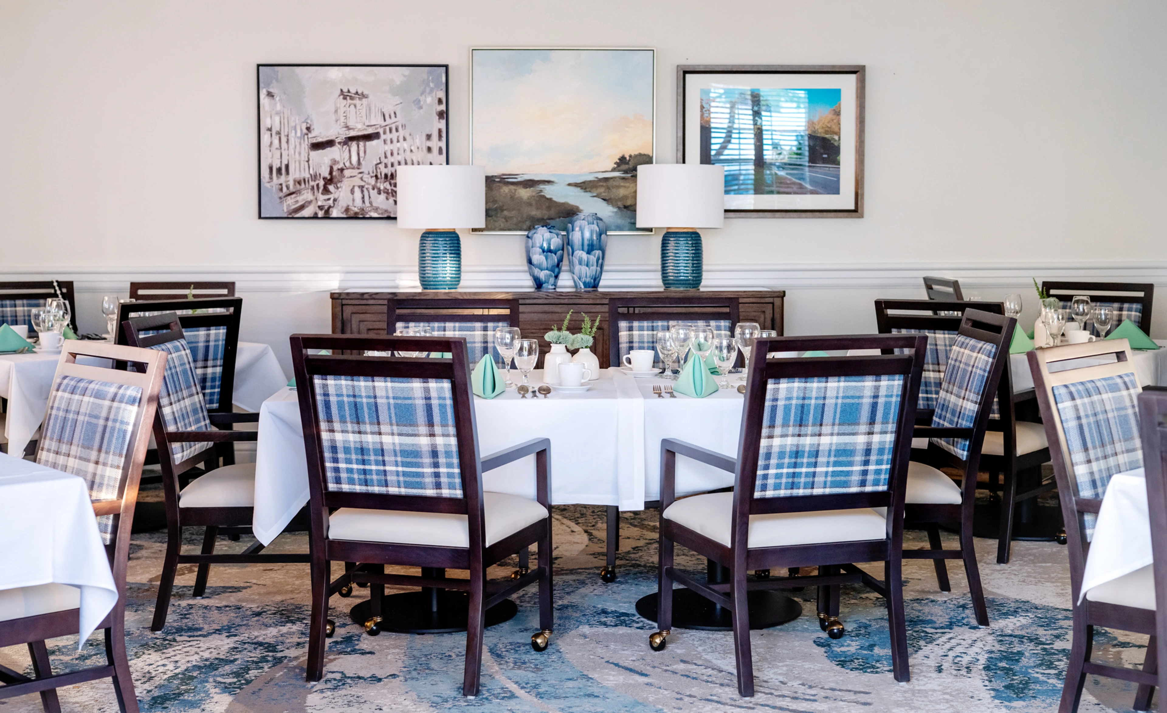 The Dining Room at Monarch Tuckahoe, showing tables, chairs and dinnerware
