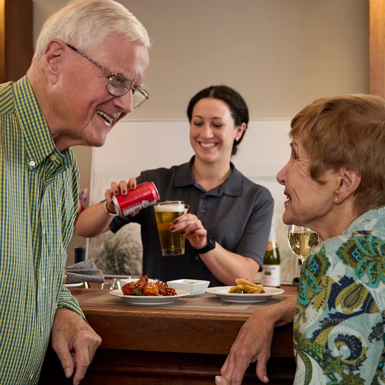 Couple at Pub with server