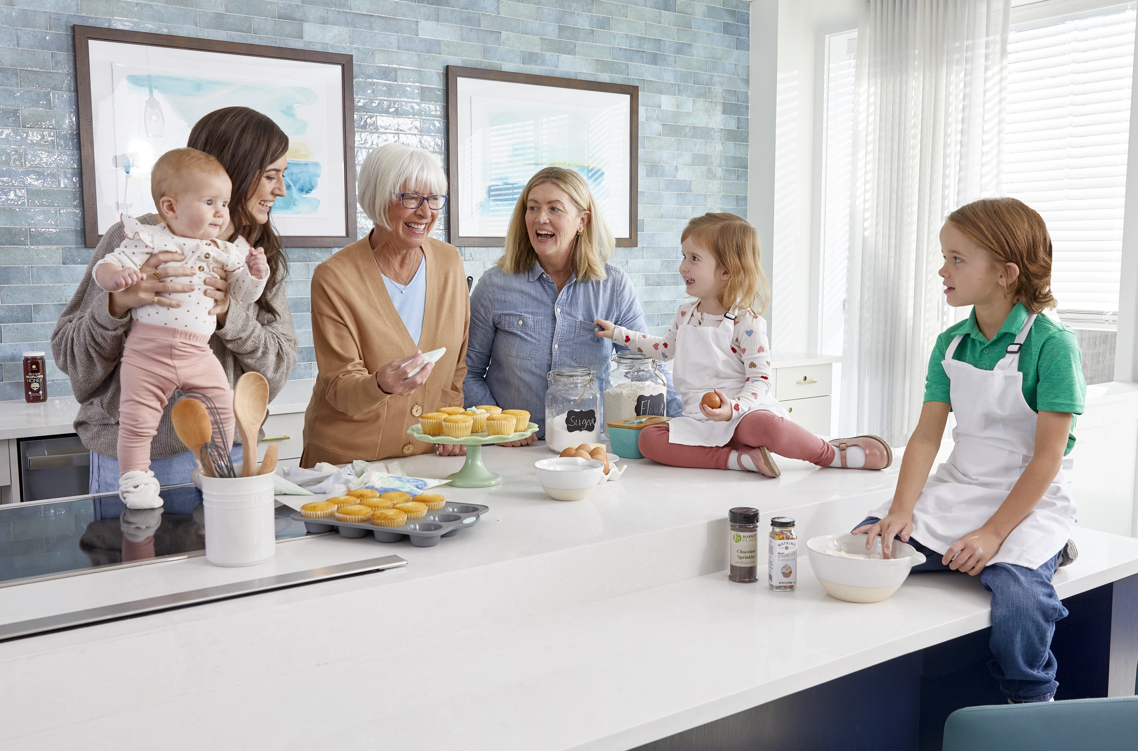 A senior and her family baking cupcakes together
