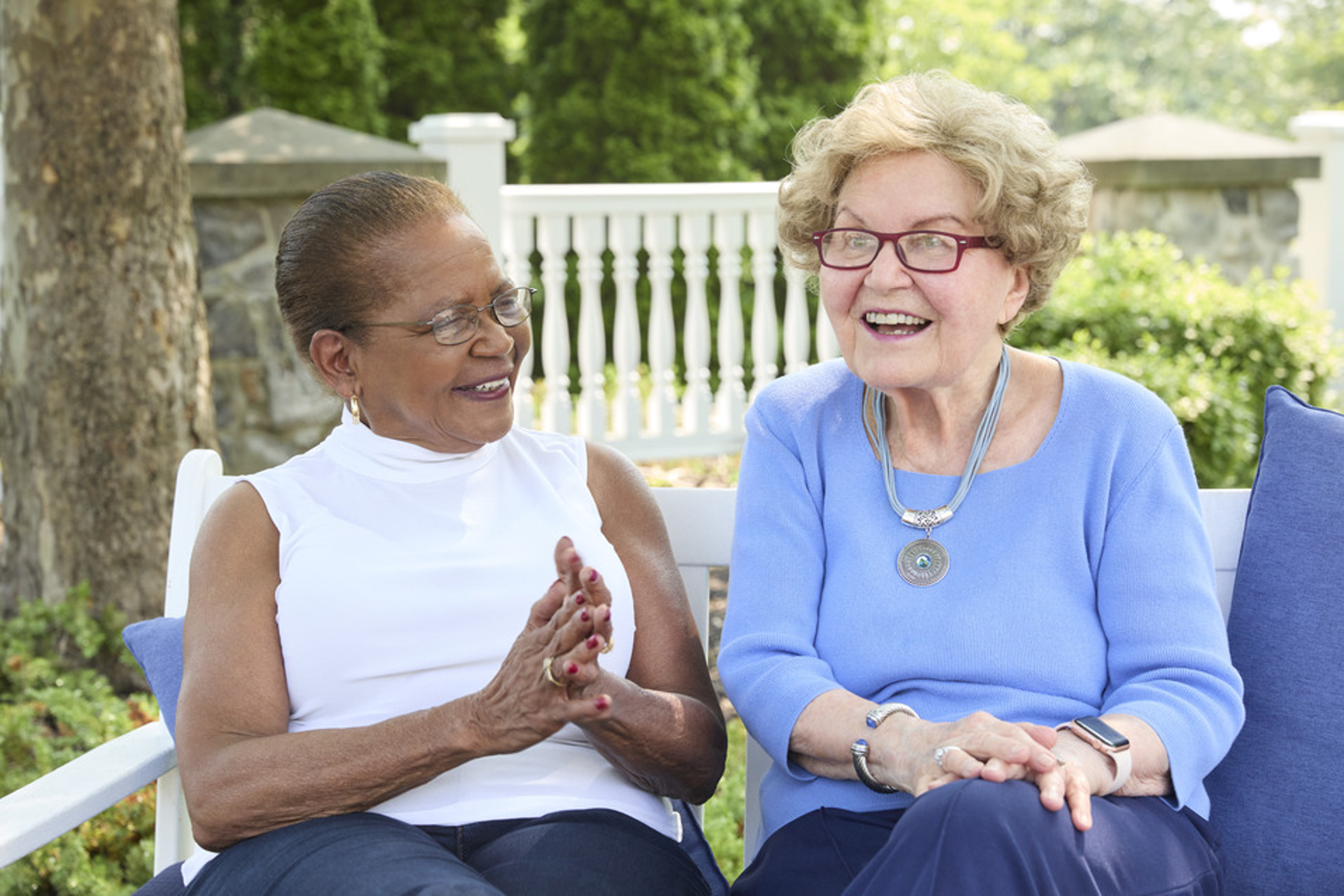 Two senior women laughing.