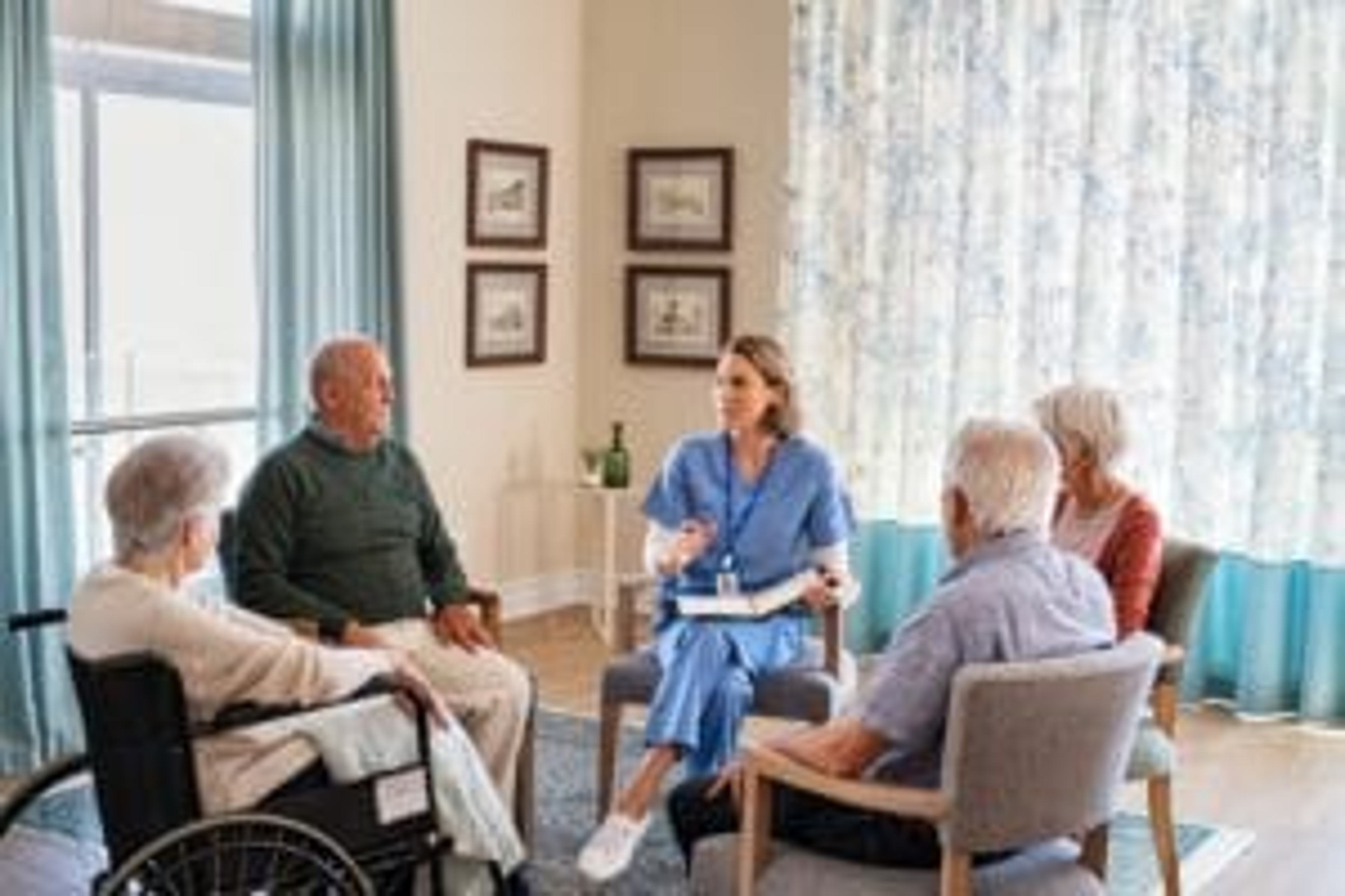 Group of Seniors meeting with nurse