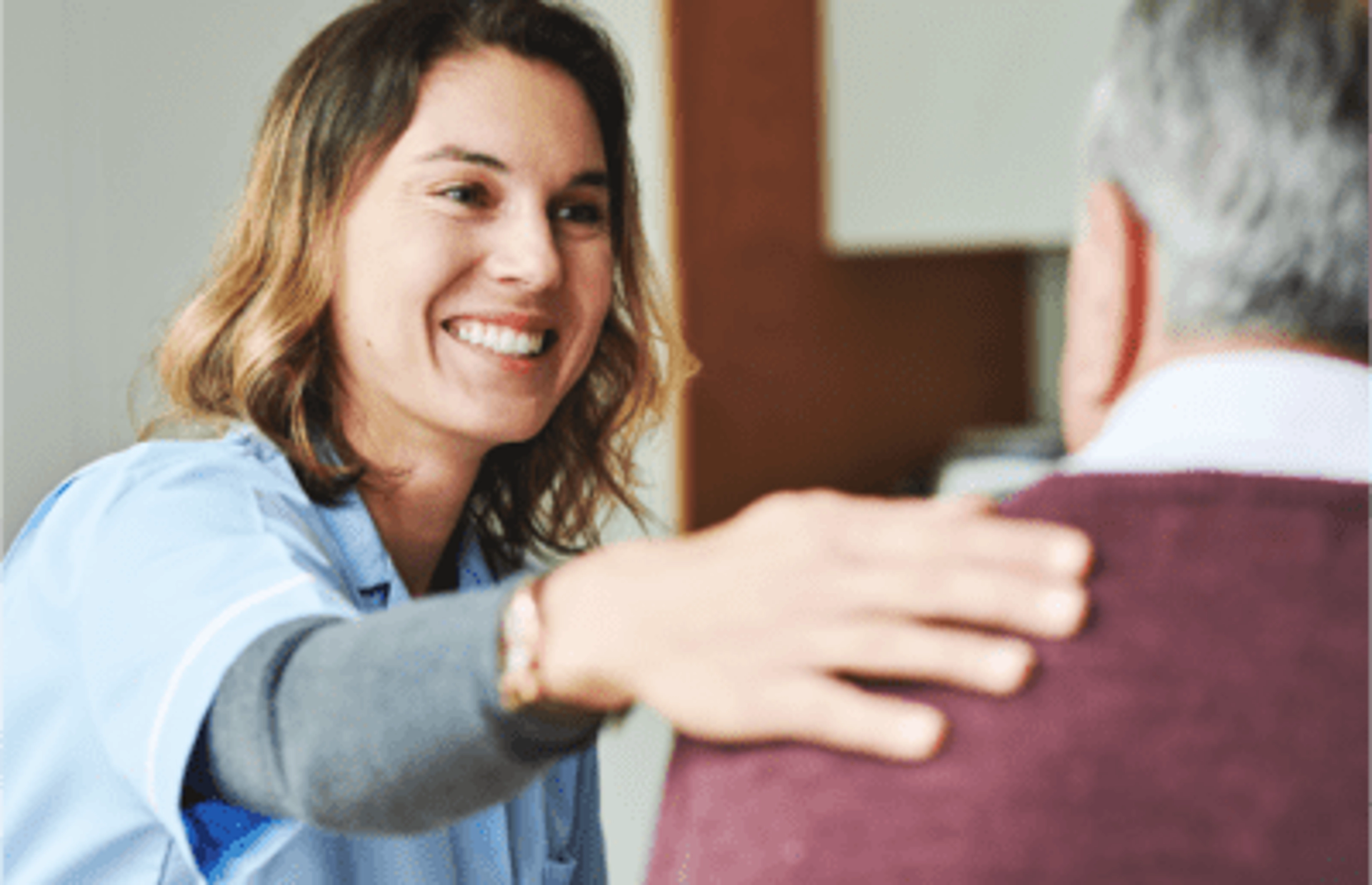 Medical Worker Helping Elderly Man