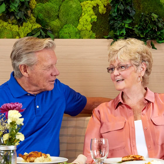 Man and woman dining outside