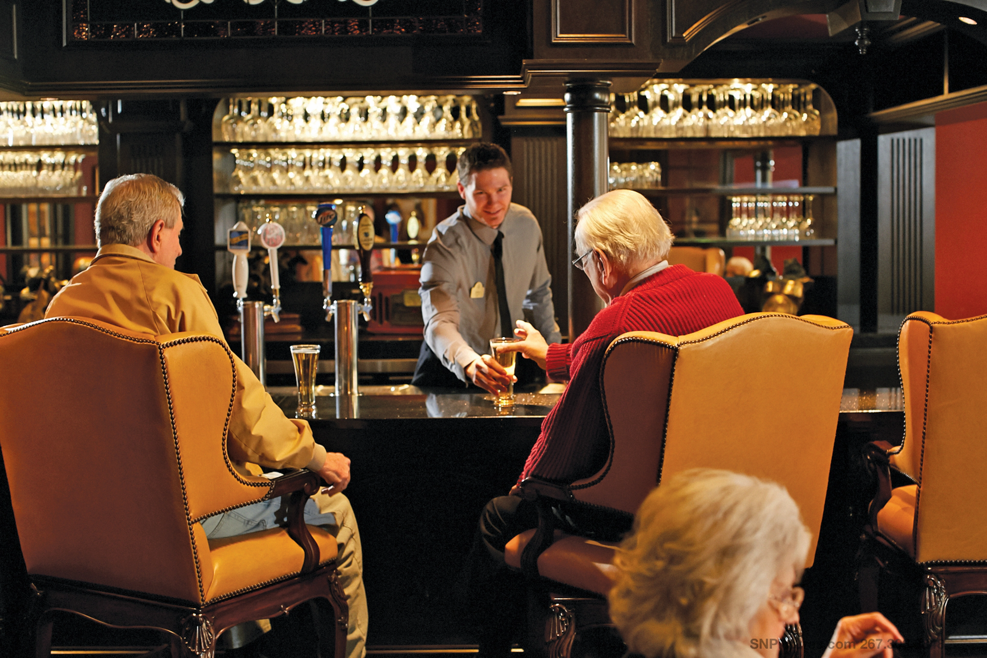 Seniors getting a drink at a bar