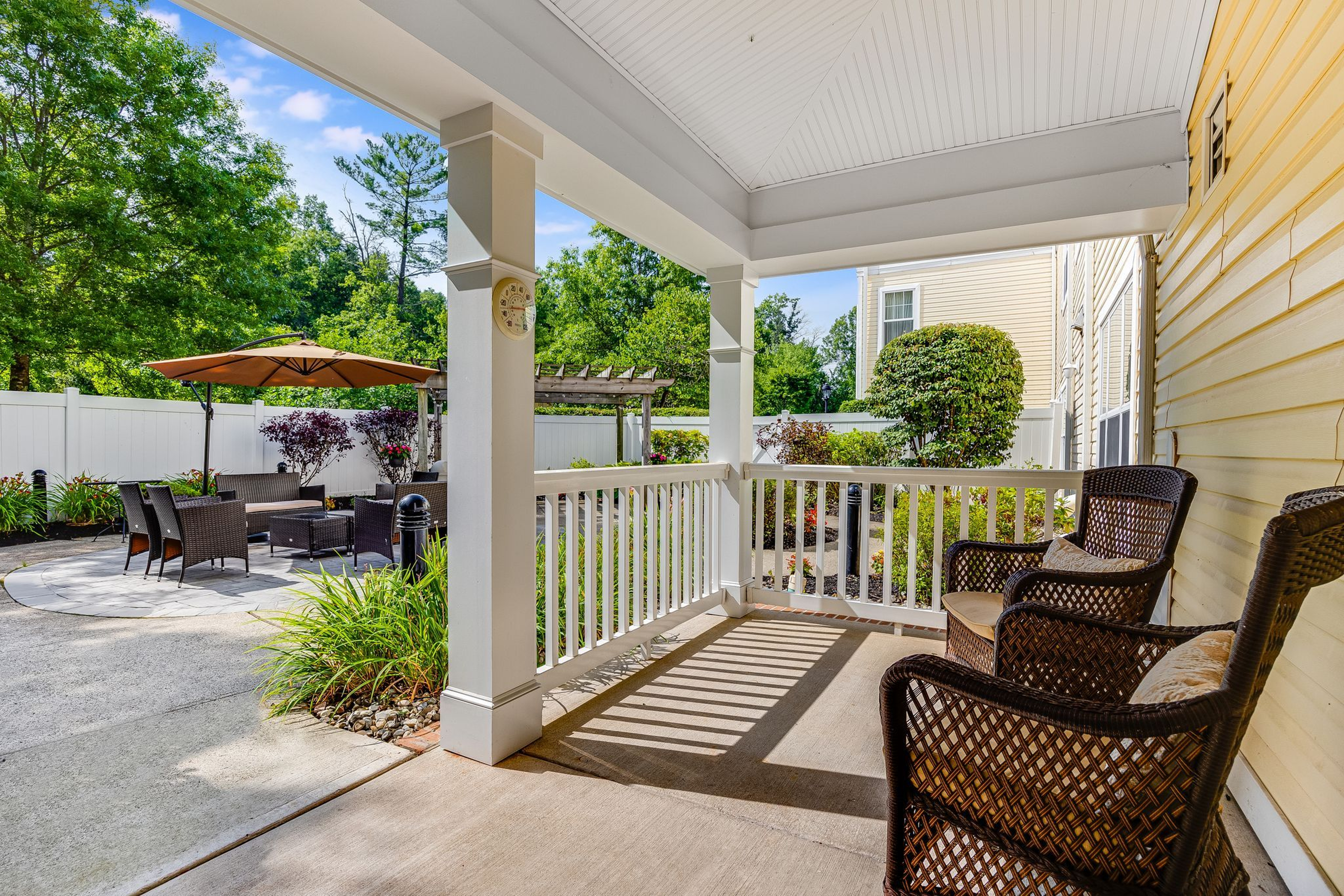 Porch with wicker chairs at Monarch Basking Ridge
