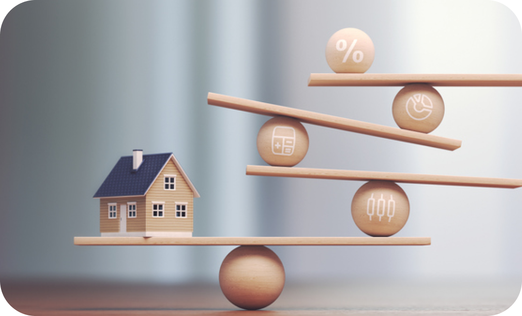Wooden balance scale with a small house on one side and wooden spheres with percent, calculator and chart icons on the other
