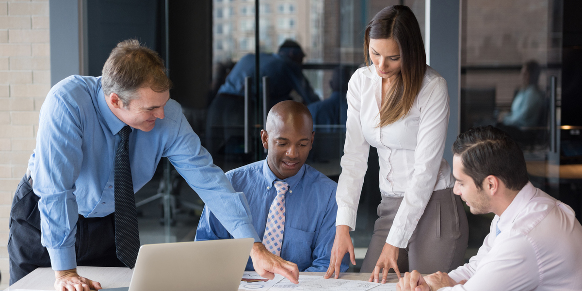Professionals collaborating around a conference table