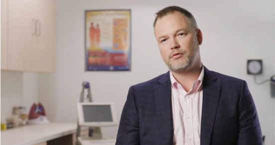 Man standing in a doctors office