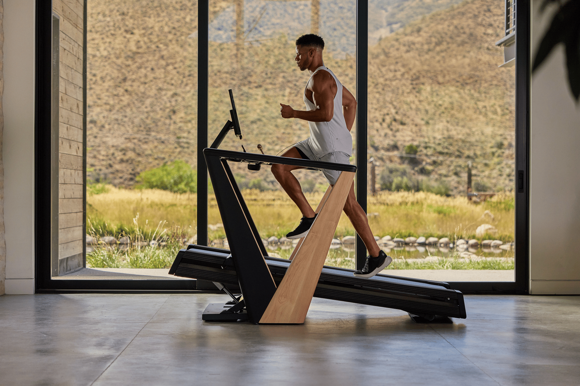 Member running on a Freemotion treadmill
