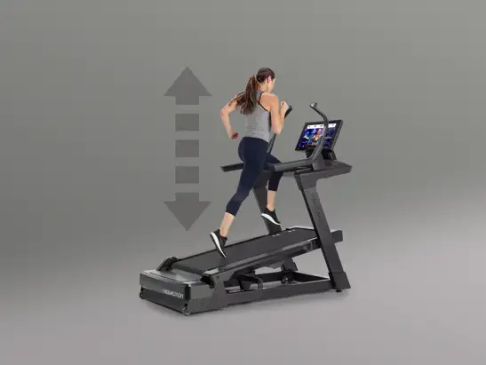 Runner using an auto-adjusting Freemotion treadmill