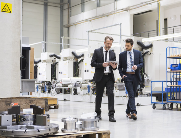 Sqre|businessmen talking in factory