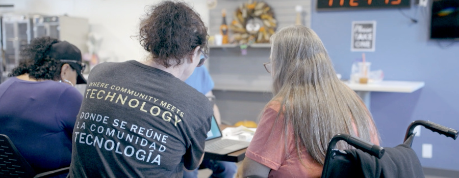 Wide|A person a woman in a wheelchair