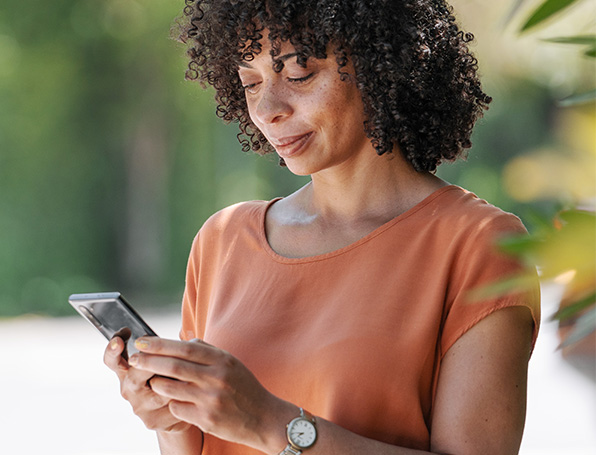 Sqre|close up of woman viewing her smartphone screen