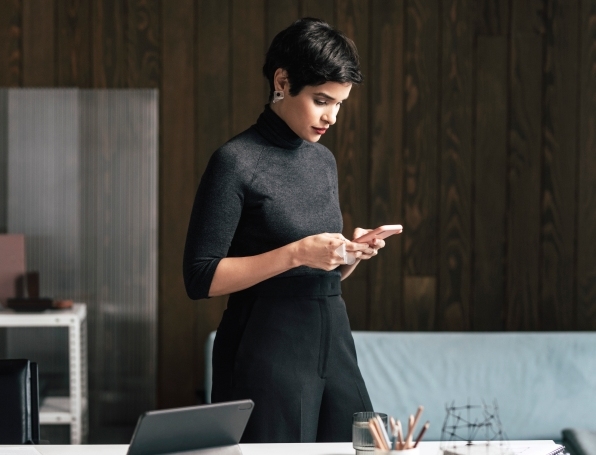 Woman in the office with phone