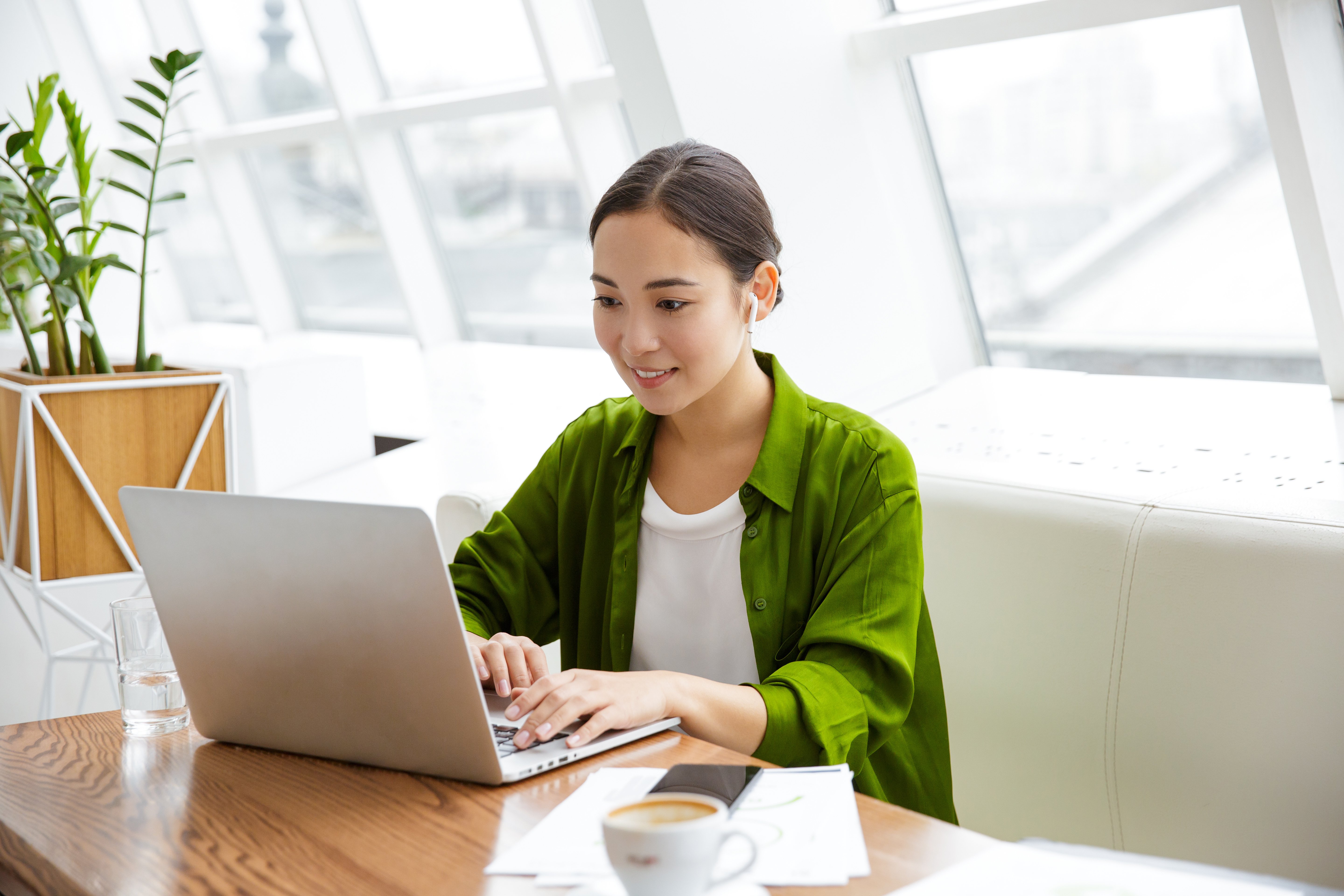 Tile|Smiling beautiful young asian woman working on laptop