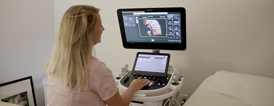 Full|Healthcare professional reviewing sonogram results