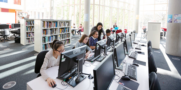 Full | Students in a library computer lab