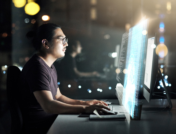 Sqre|Man working on a large computer screen