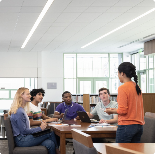 Sqre | Higher Ed students meeting in school library