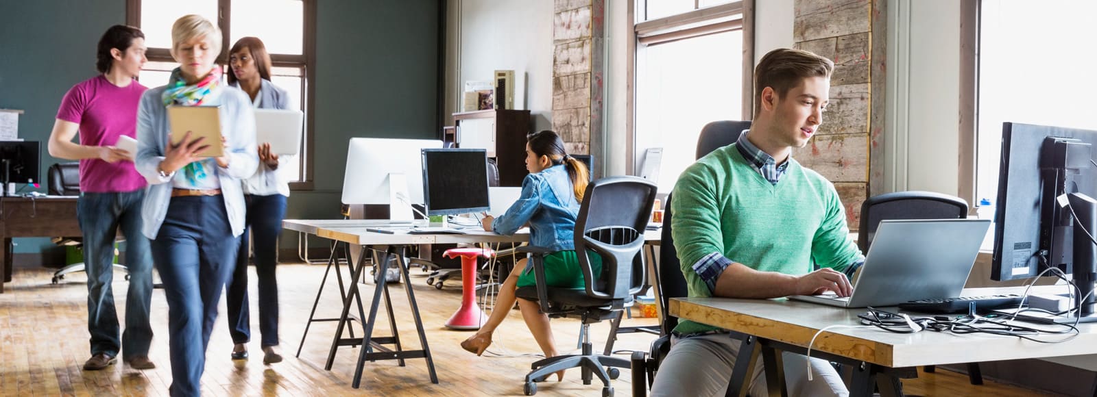 Full|Group of people working in an open office