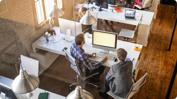 Wide|Overhead shot looking down into open office space