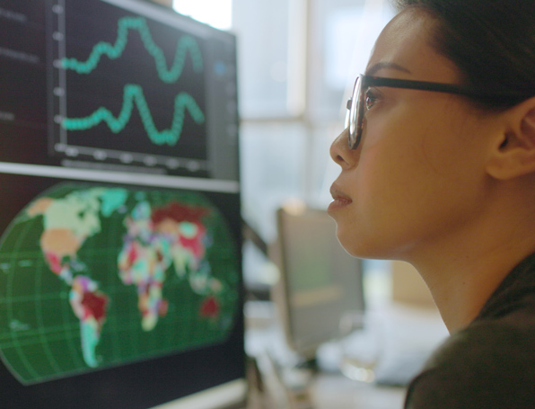 Sqre|Woman viewing data on a computer screen