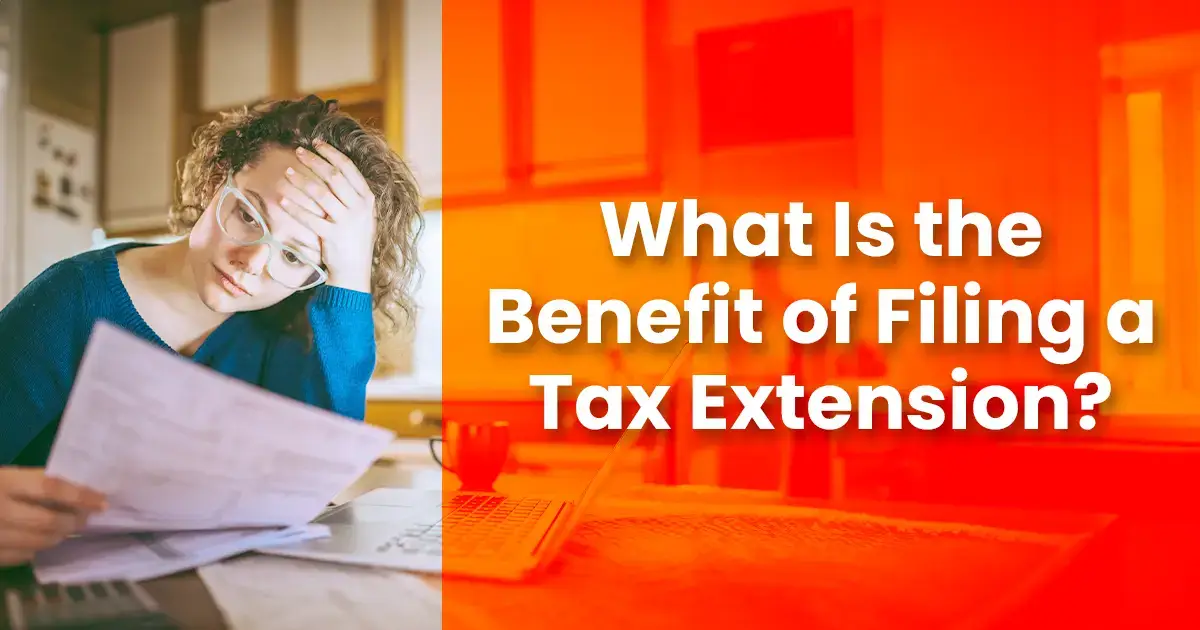 Woman looking stressed while reading documents at a desk, with text overlay "what is the benefit of filing a tax extension?" in an office setting.