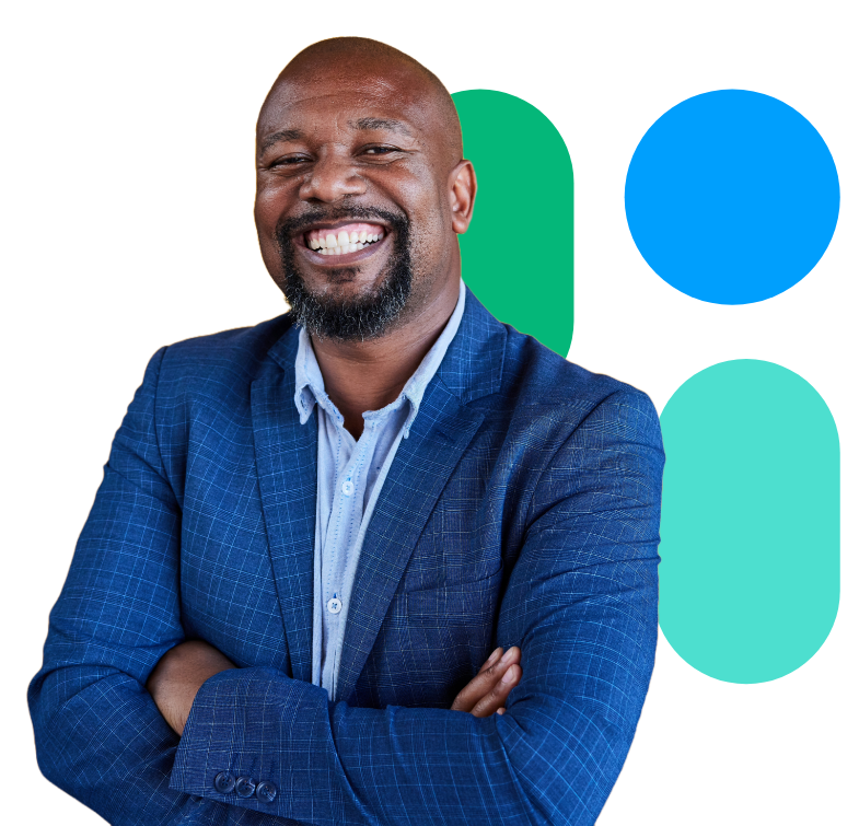 A smiling man in a blue suit with his arms crossed.