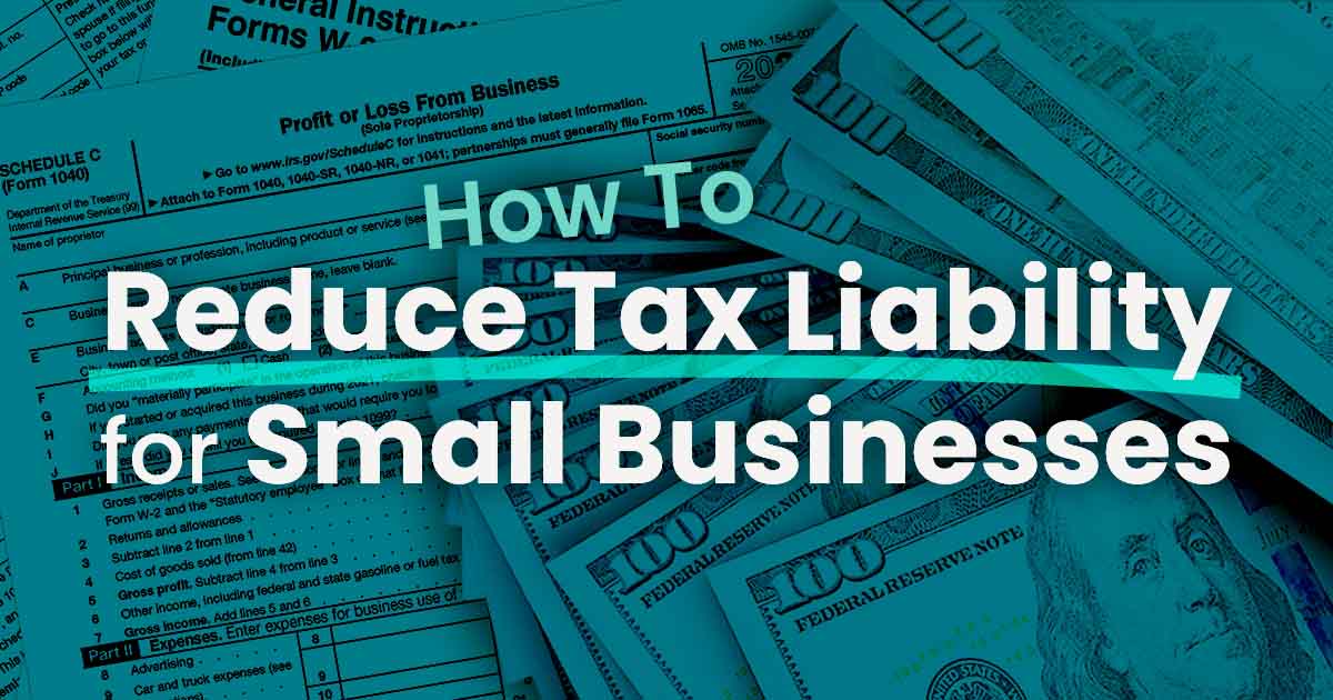 One hundred dollar bills laying on top small business tax forms as the business owner ponders how to reduce their tax liability.