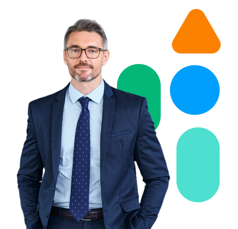 A man in a suit and tie stands confidently in front of bright, vibrant shapes.