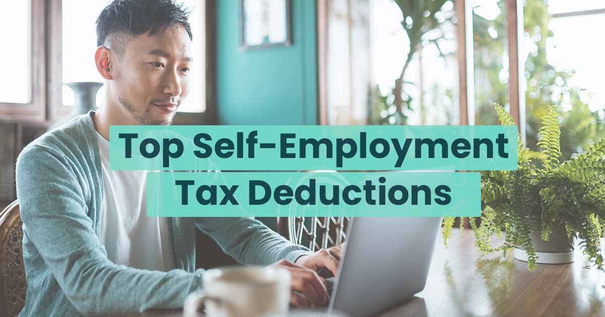 Man researching self-employment tax deductions on his laptop in a bright, plant-filled room. text overlay: "top self-employment tax deductions.