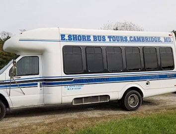 E shore bus tours bus on a dirt road