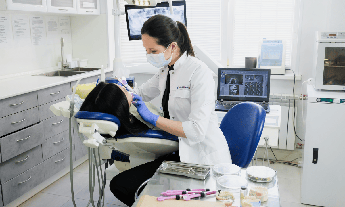 image of dentist checking the patient's teeth