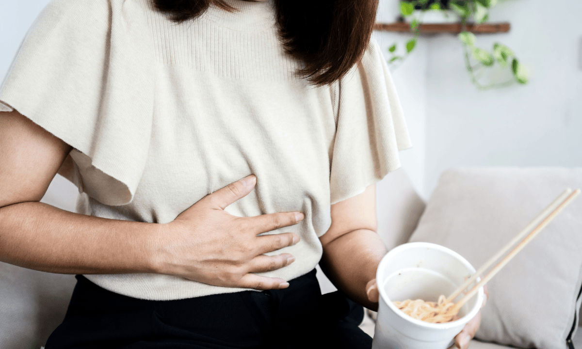 A woman touching her stomach