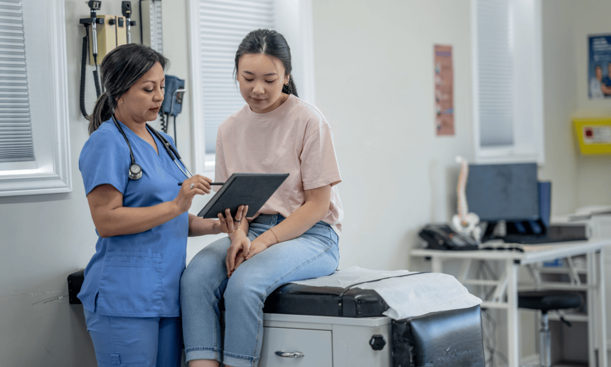 doctor explaining to her patient about health screening