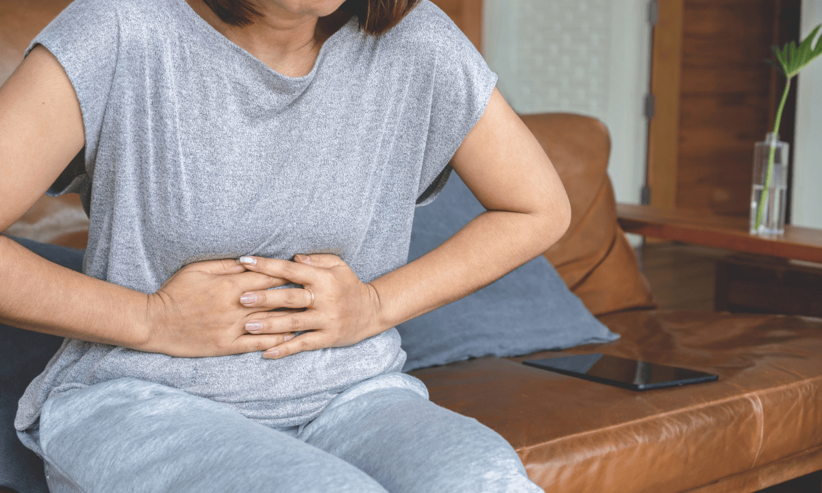 A-woman-experiences-abdominal-pain-due-to-diarrhea