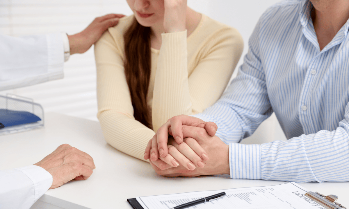 image of couple talking with the doctor
