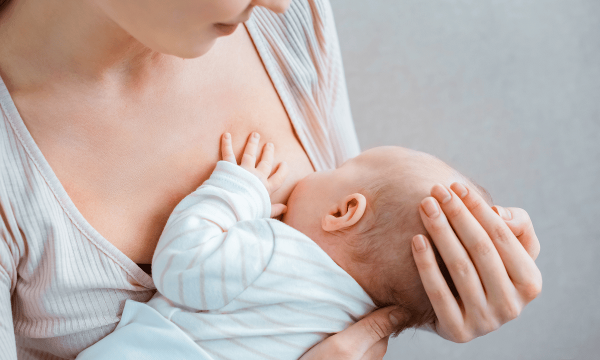 woman breastfeeding a baby