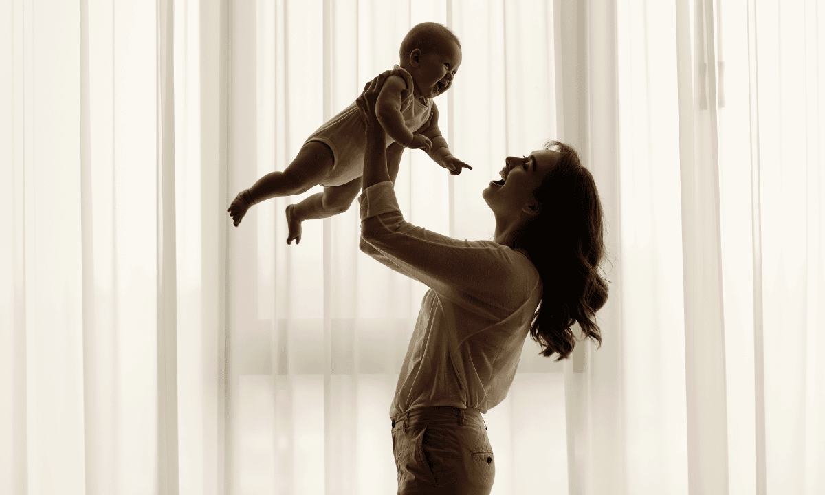 mother playing with her little one