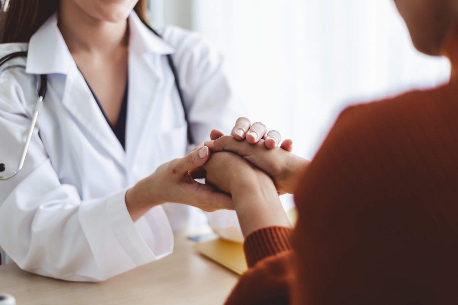 breast care specialist doctor consulting an treating female breast patient