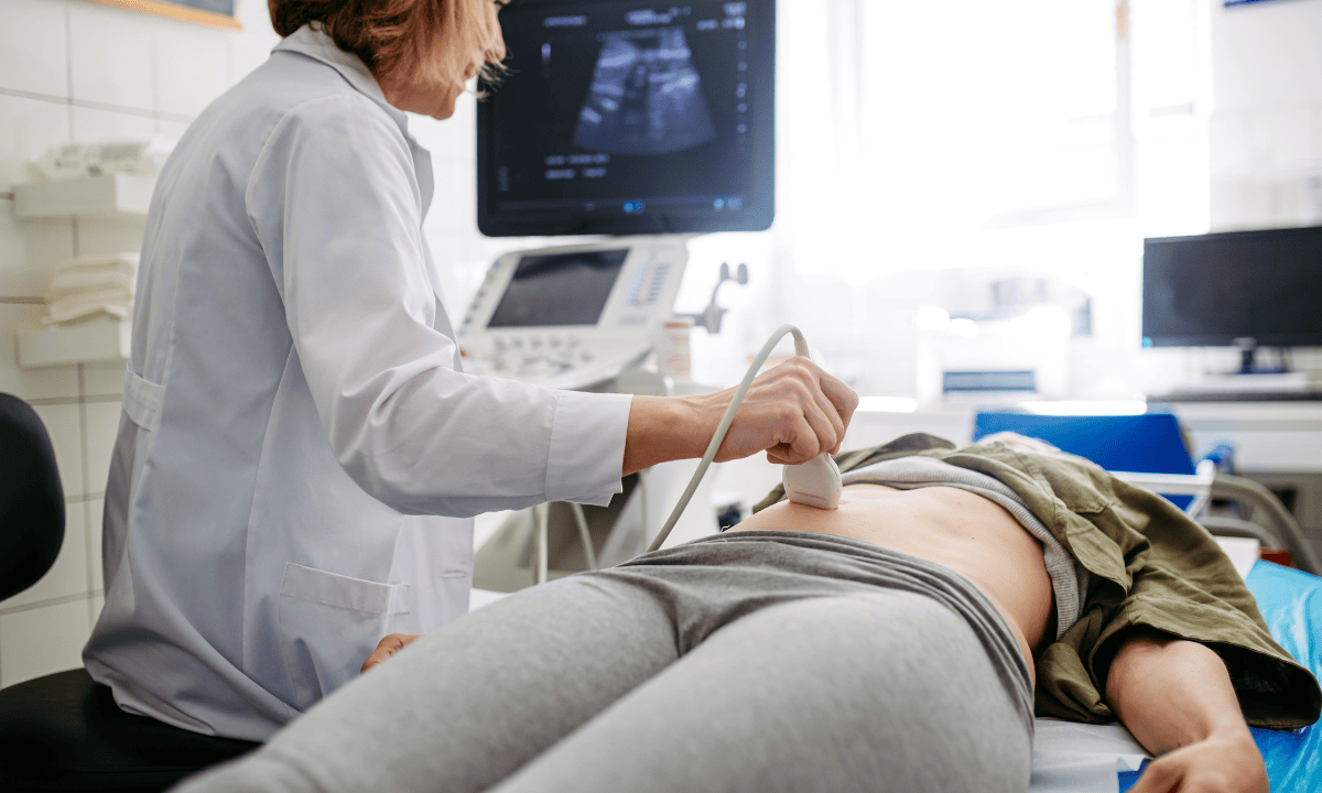 a-doctor-diagnoses-upper-abdominal-pain-for-a-patient