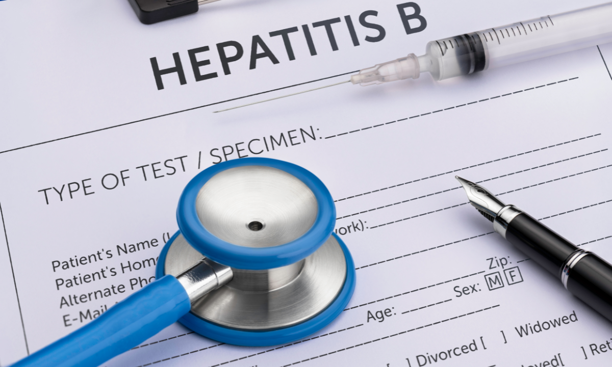 A hearing device next to a doctor’s informational sheet
